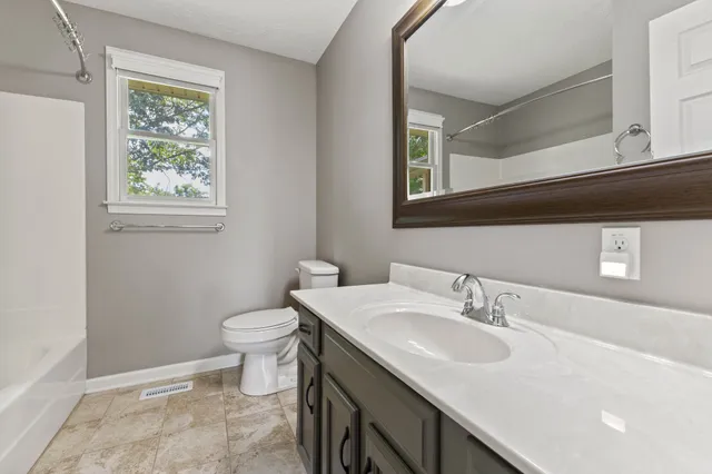 a bathroom with a sink and a toilet
