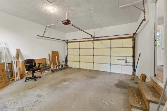 a view of a livingroom with furniture and a window