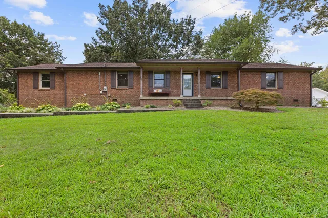 front view of a house with a yard