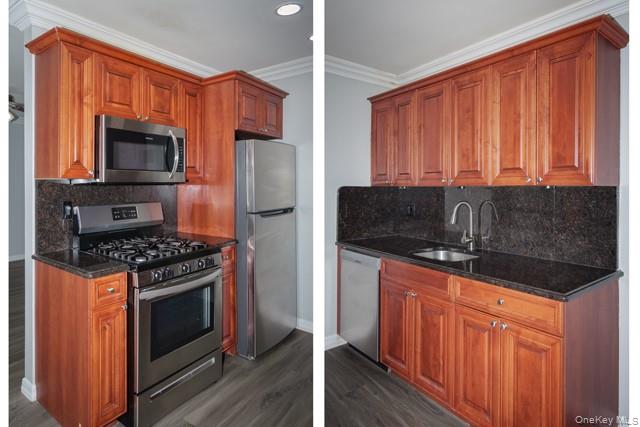 1750 West Main Street, Unit B06 Riverhead, NY 11901 - Photo 2 of 10 a kitchen with stainless steel appliances granite countertop a stove a microwave and a refrigerator
