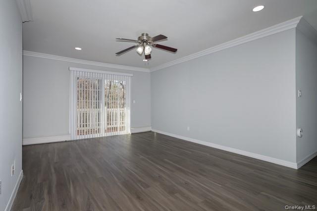 1750 West Main Street, Unit B06 Riverhead, NY 11901 - Photo 4 of 10 a view of an empty room with wooden floor and a window