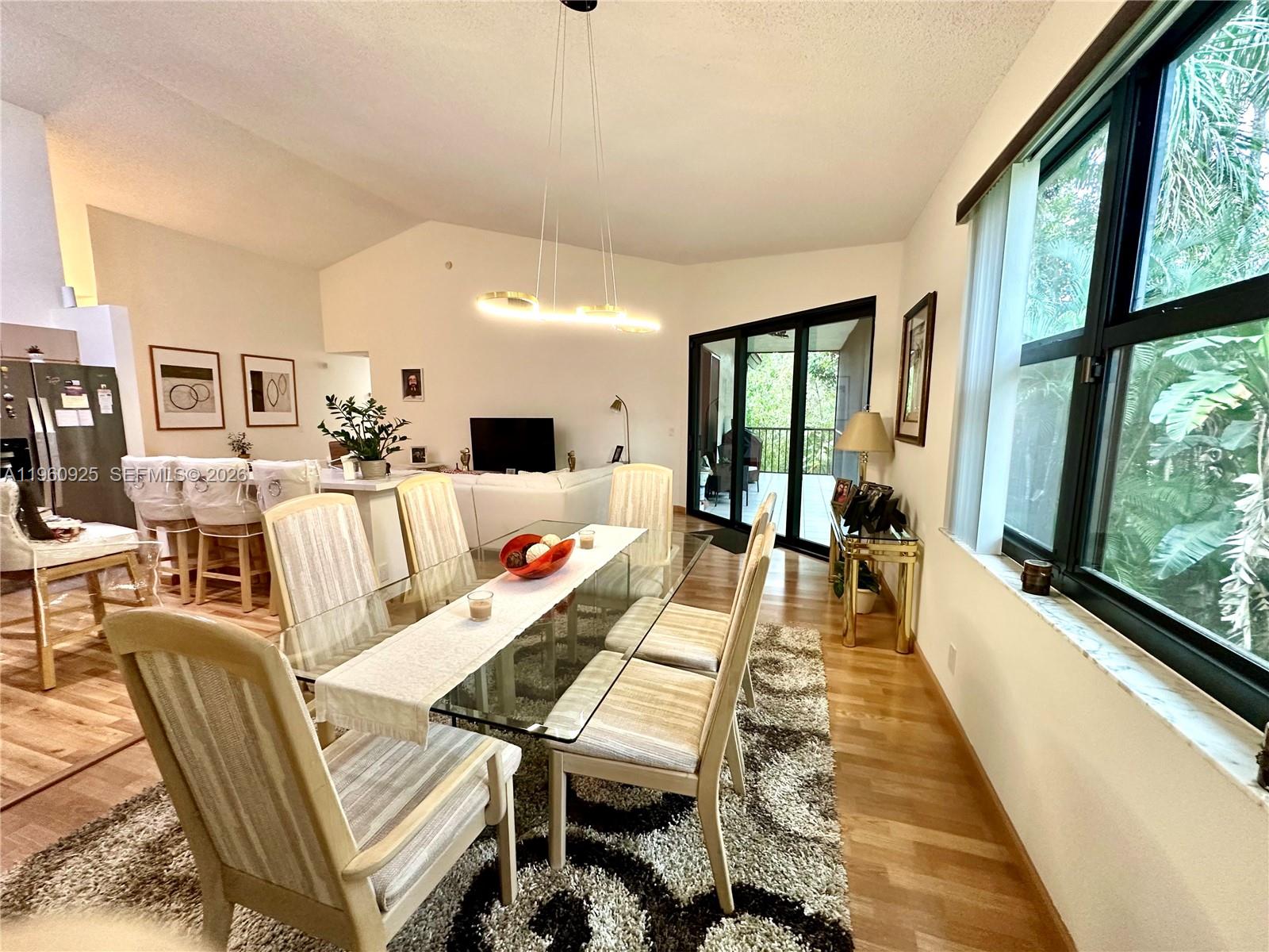 5790 Coach House Circle, Unit E Boca Raton, FL 33486 - Photo 14 of 65 a living room with furniture and a large window