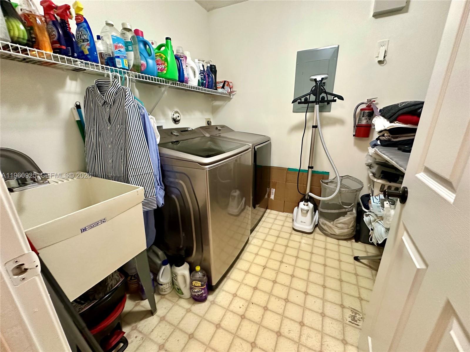 5790 Coach House Circle, Unit E Boca Raton, FL 33486 - Photo 50 of 65 a storage room with washer and dryer