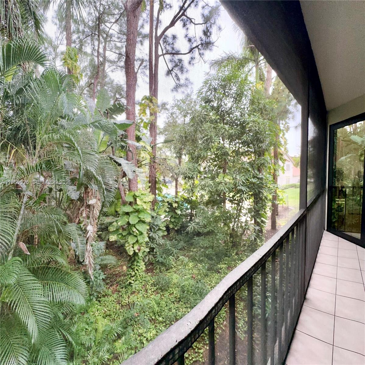 5790 Coach House Circle, Unit E Boca Raton, FL 33486 - Photo 54 of 65 a view of balcony with green space