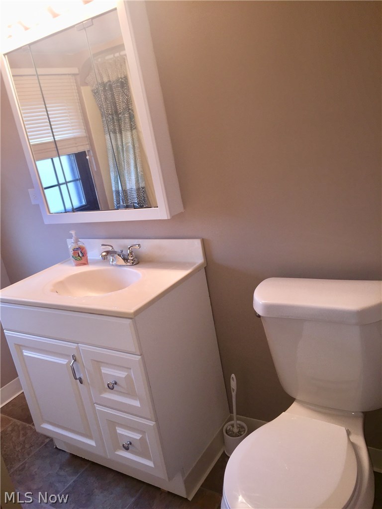 9750 Snow Road Cleveland, OH 44130 - Photo 17 of 24 Second Story full bath was pleasantly remodeled in 2014! Newer: vanity, commode, lighting, medicine chest, and flooring is in terrific condition!