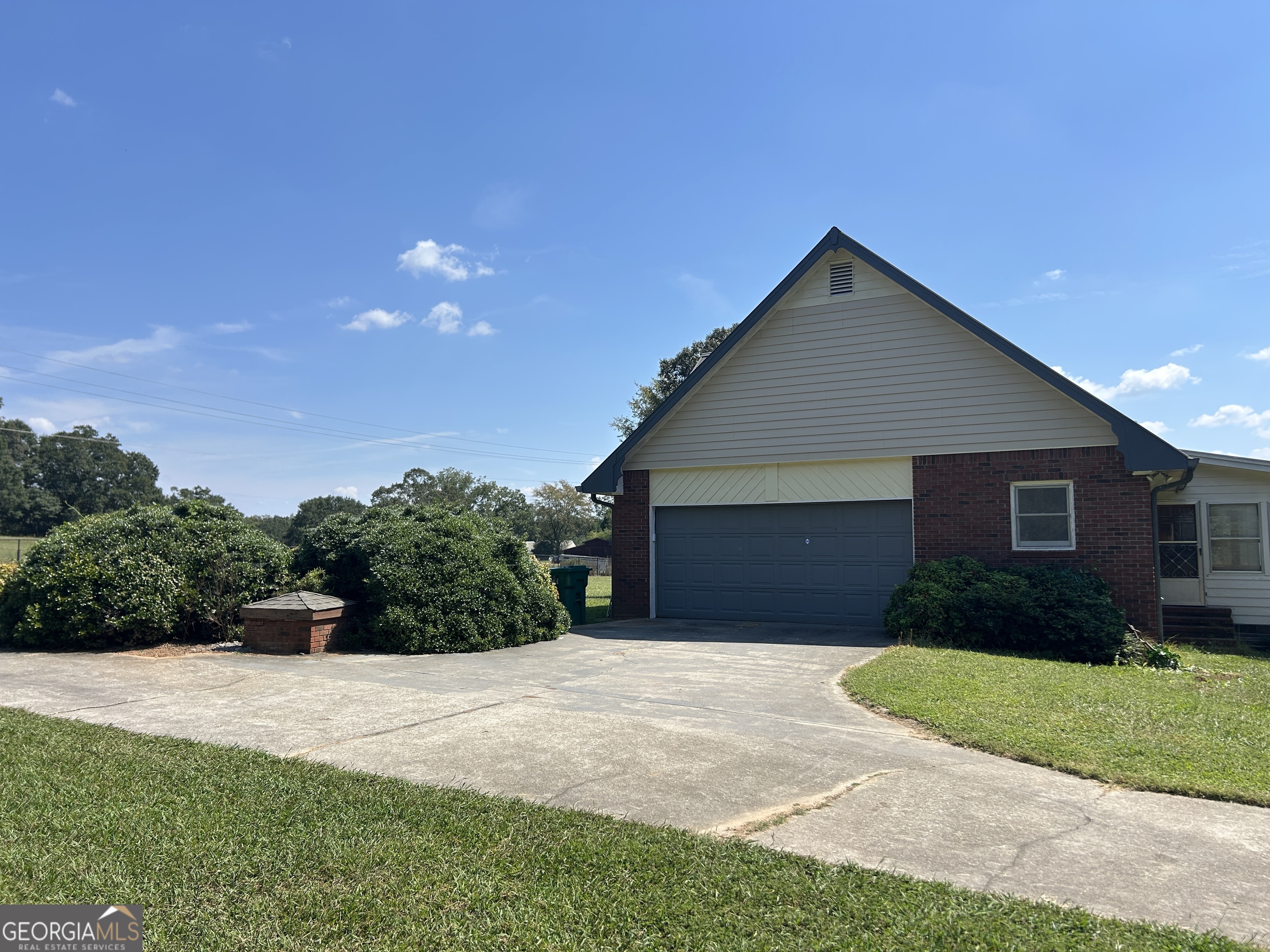 817 Yonah Homer Road Homer, GA 30547 - Photo 28 of 43 a front view of a house with a yard and garage