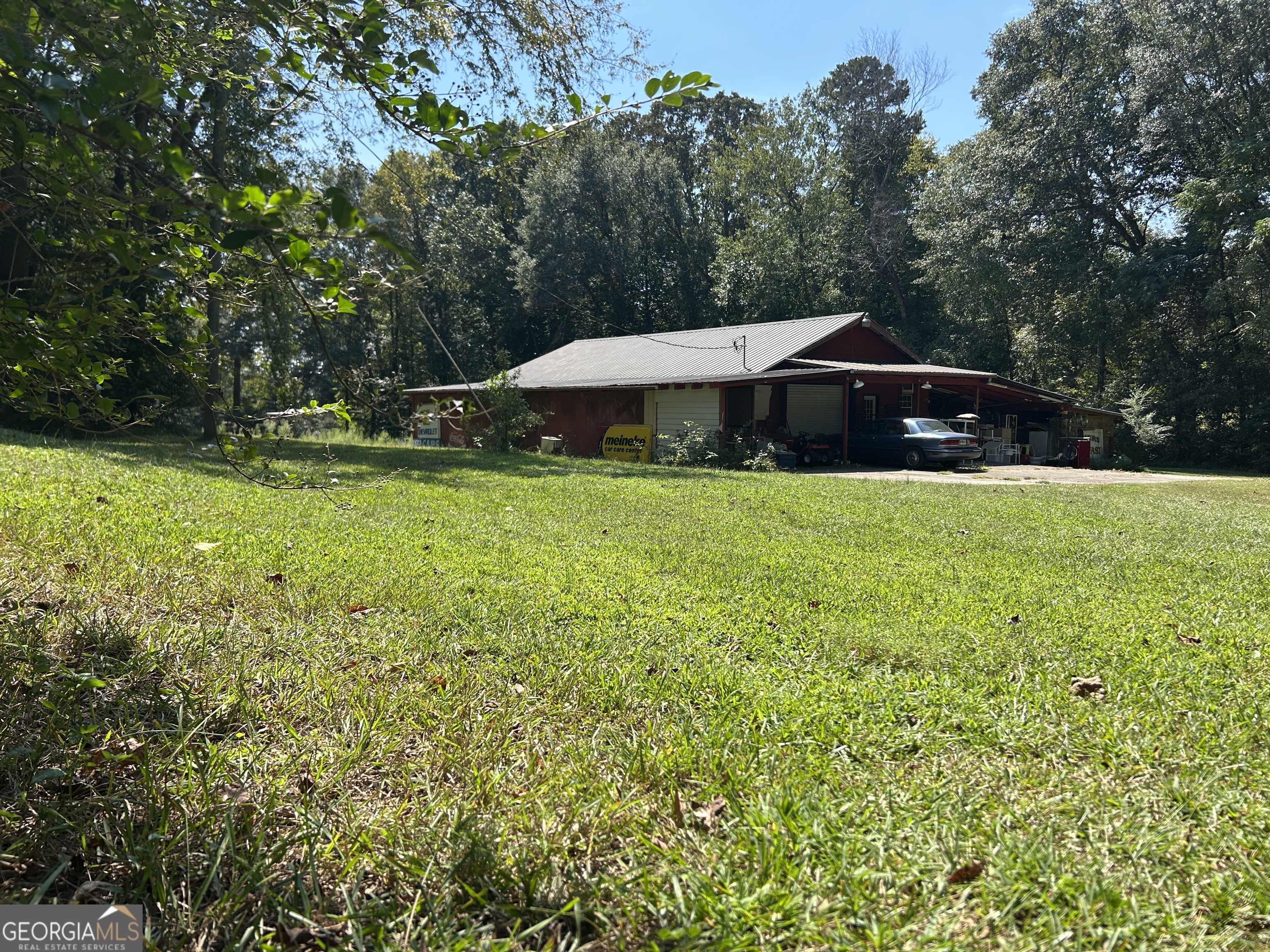 817 Yonah Homer Road Homer, GA 30547 - Photo 30 of 43 a swimming pool with outdoor seating and yard