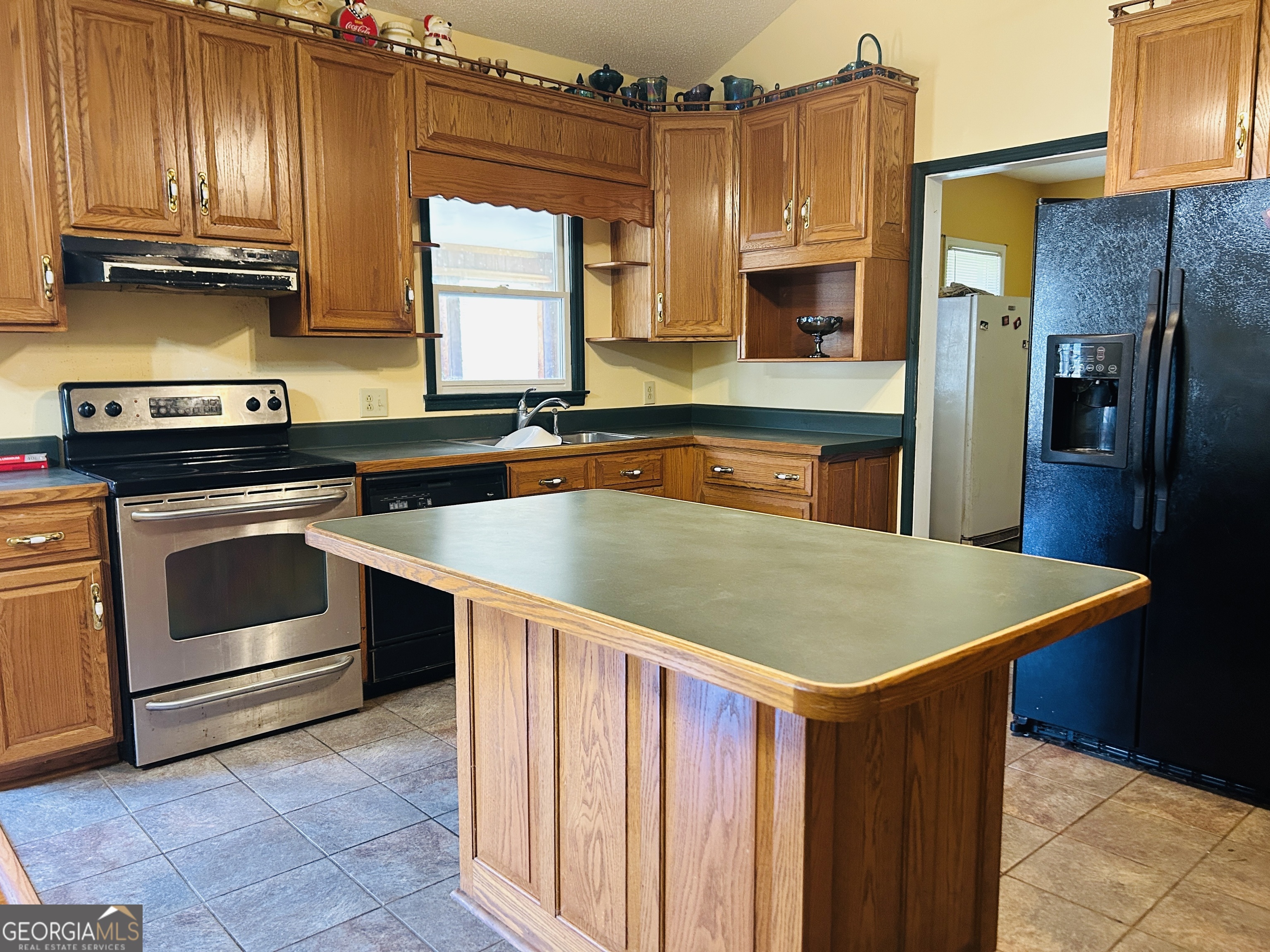 817 Yonah Homer Road Homer, GA 30547 - Photo 10 of 43 a kitchen that has a sink stainless steel appliances wooden floor and cabinets