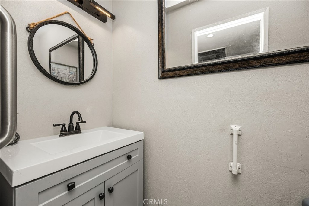 7381 Katella Avenue Stanton, CA 90680 - Photo 5 of 21 1/2 bath downstairs
