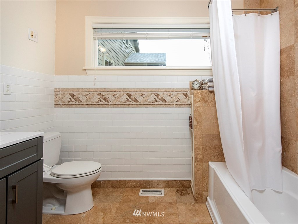 803 North 33rd Street Renton, WA 98056 - Photo 23 of 40 a bathroom with a toilet and a mirror