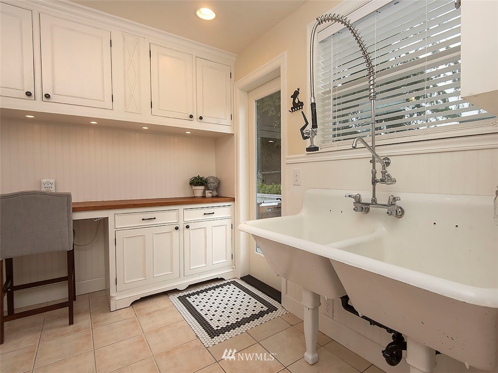 803 North 33rd Street Renton, WA 98056 - Photo 25 of 40 a kitchen with a sink cabinets and window