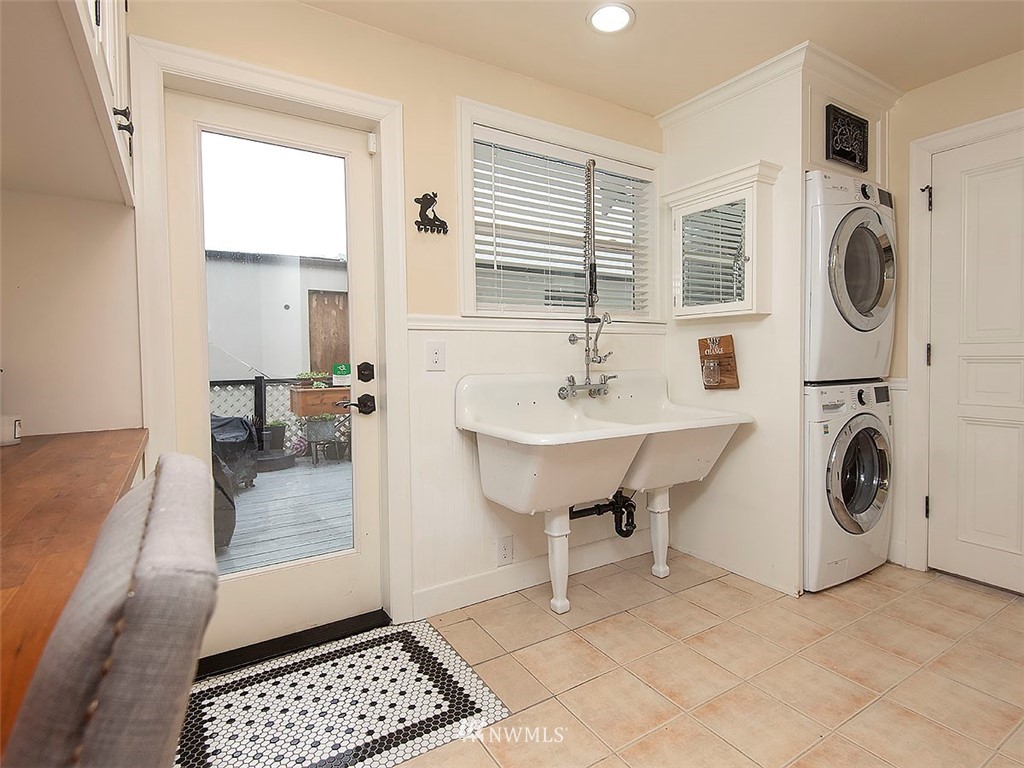 803 North 33rd Street Renton, WA 98056 - Photo 28 of 40 a view of a hallway with washer and dryer