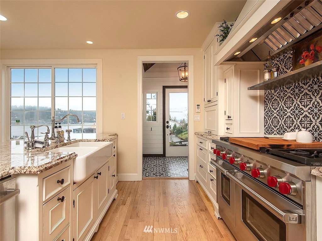 803 North 33rd Street Renton, WA 98056 - Photo 6 of 40 a kitchen with sink stove and cabinets