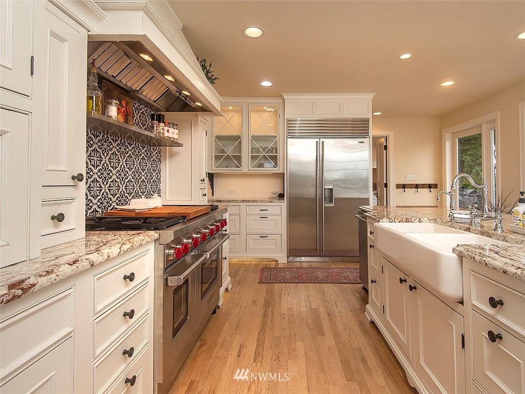 803 North 33rd Street Renton, WA 98056 - Photo 8 of 40 a kitchen with stainless steel appliances granite countertop a stove and a sink