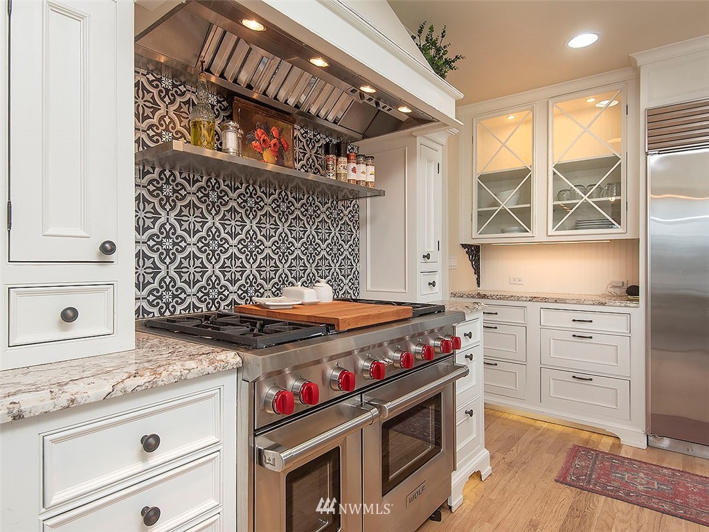 803 North 33rd Street Renton, WA 98056 - Photo 9 of 40 a kitchen with stainless steel appliances granite countertop a stove and a cabinet