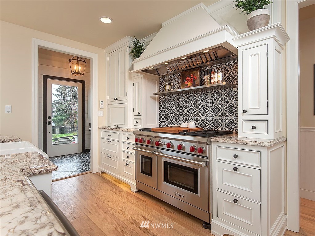 803 North 33rd Street Renton, WA 98056 - Photo 10 of 40 a kitchen with a stove and a microwave