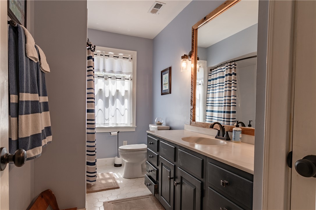 620 Seminole Point Road Fair Play, SC 29643 - Photo 29 of 50 A spacious vanity with integrated sink anchors this well-appointed bathroom space.