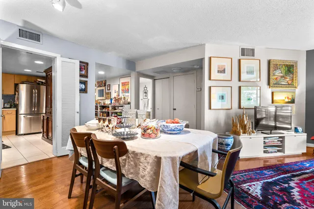 a view of a dining room with furniture and wooden floor