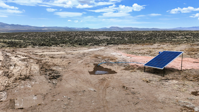 123 East Tbd 5000 Road North Panguitch, UT 84759 - Photo 11 of 54 Expansive desert terrain with a mounted solar panel system