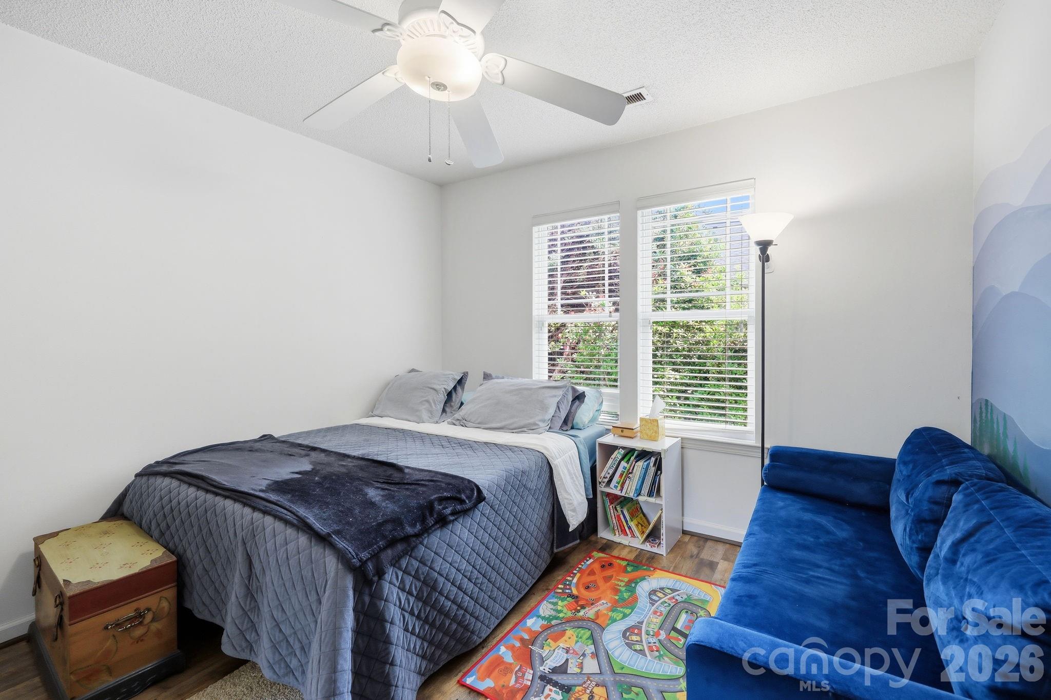 51 Sunview Circle Arden, NC 28704 - Photo 16 of 31 a spacious bedroom with a bed and a window