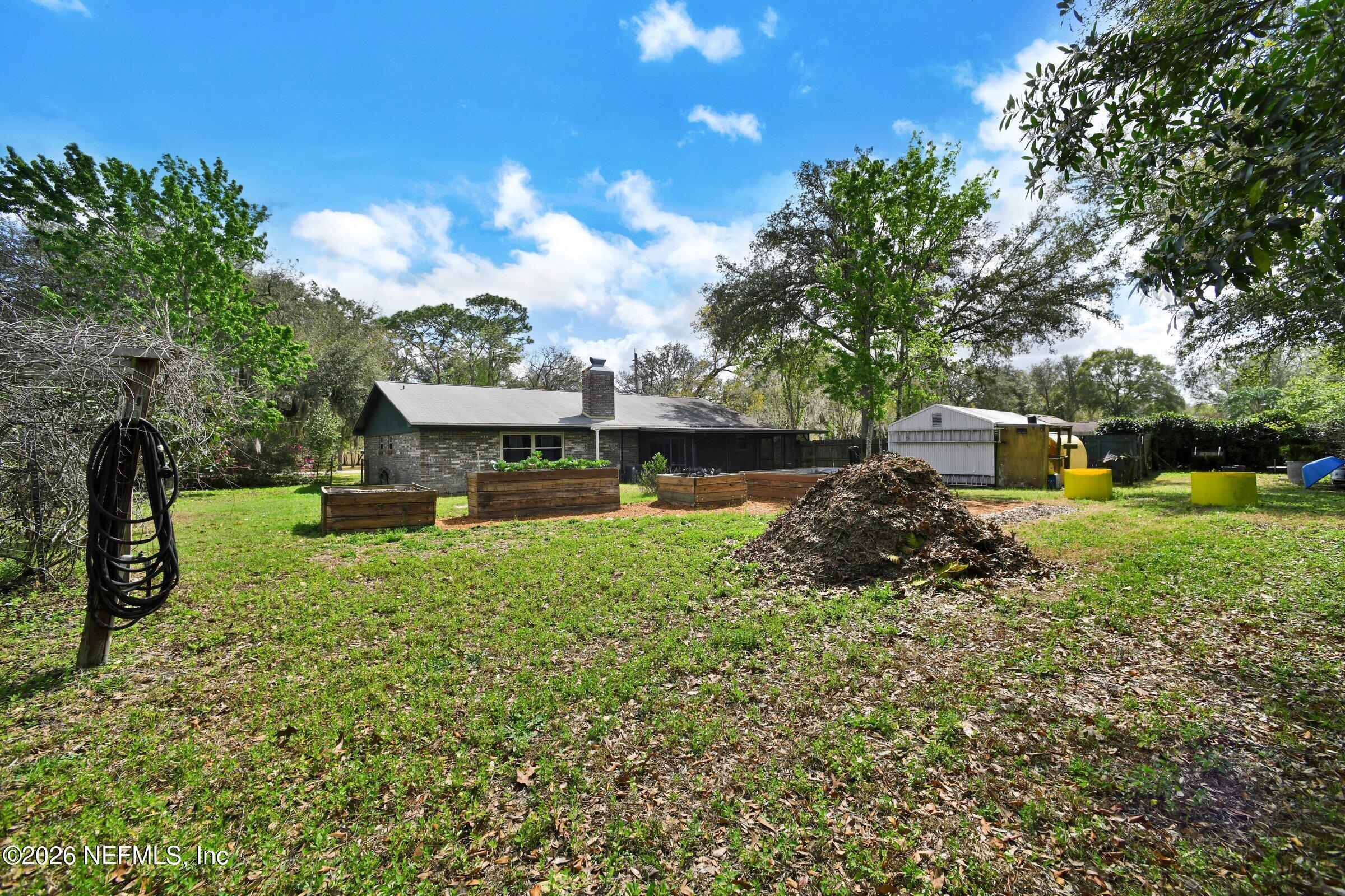 12790 Allport Road Jacksonville, FL 32258 - Photo 11 of 39 a view of a house with a yard