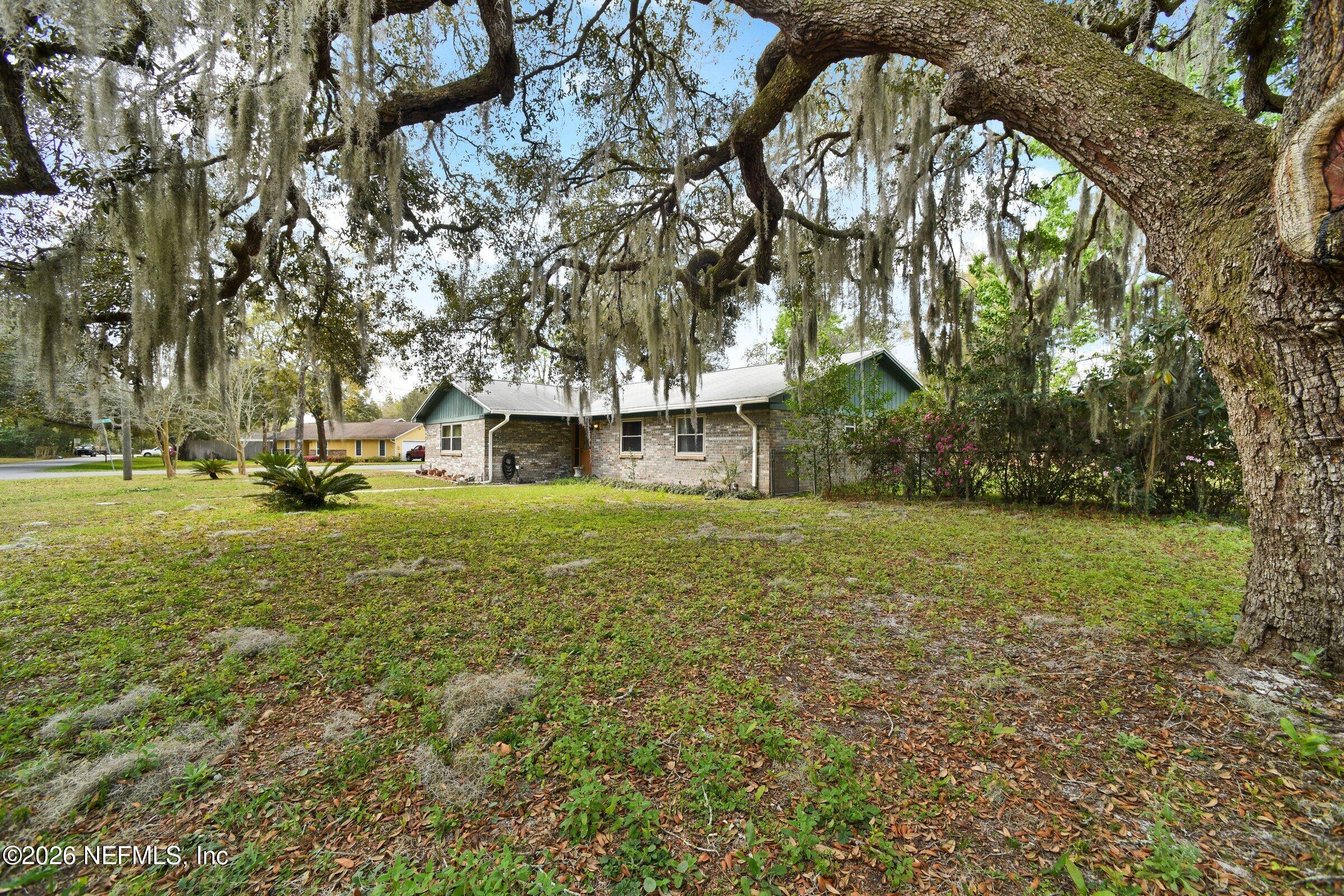 12790 Allport Road Jacksonville, FL 32258 - Photo 2 of 39 a front view of a house with a yard