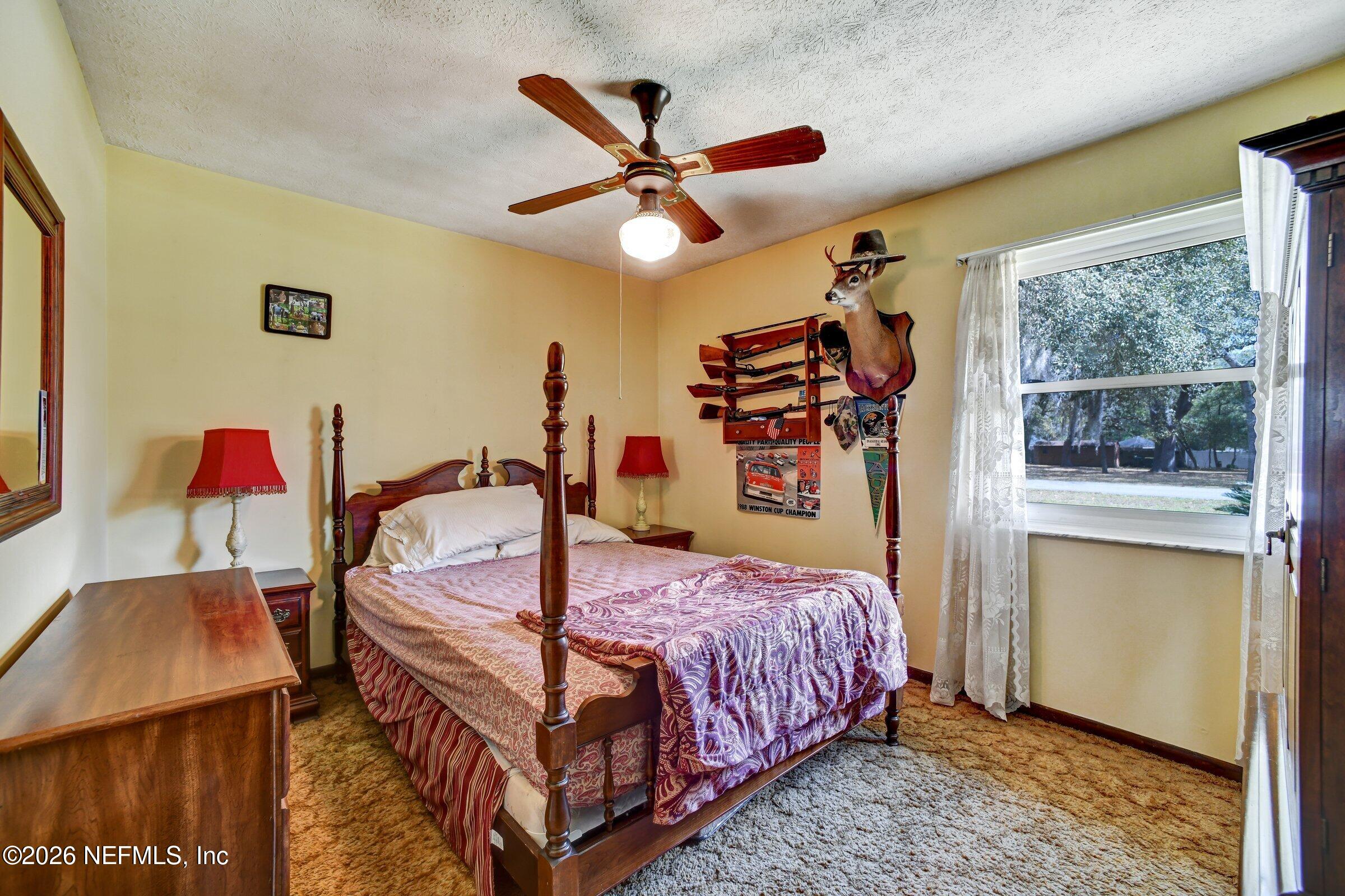 12790 Allport Road Jacksonville, FL 32258 - Photo 28 of 39 a bedroom with a bed and window