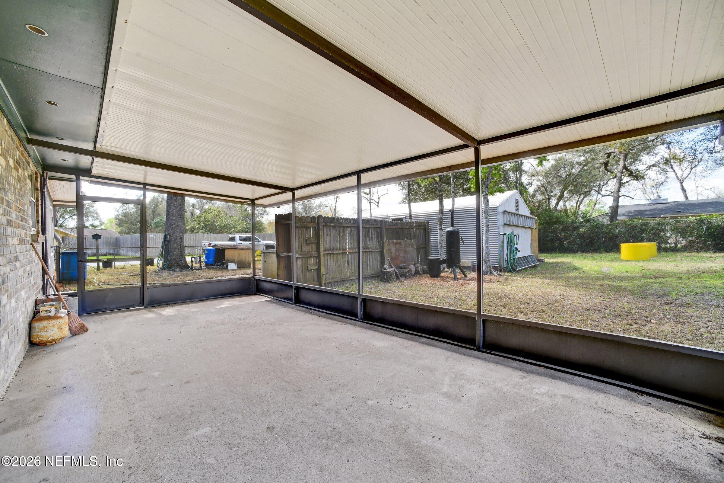12790 Allport Road Jacksonville, FL 32258 - Photo 39 of 39 a view of an empty room with sliding glass door