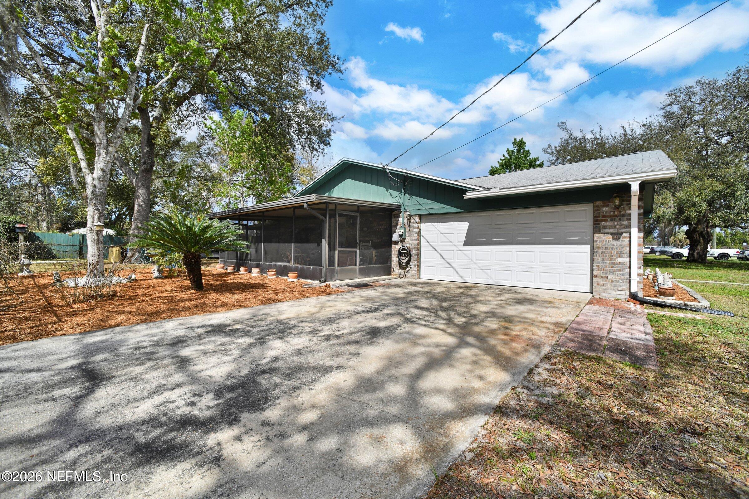 12790 Allport Road Jacksonville, FL 32258 - Photo 7 of 39 a backyard of a house with table and chairs