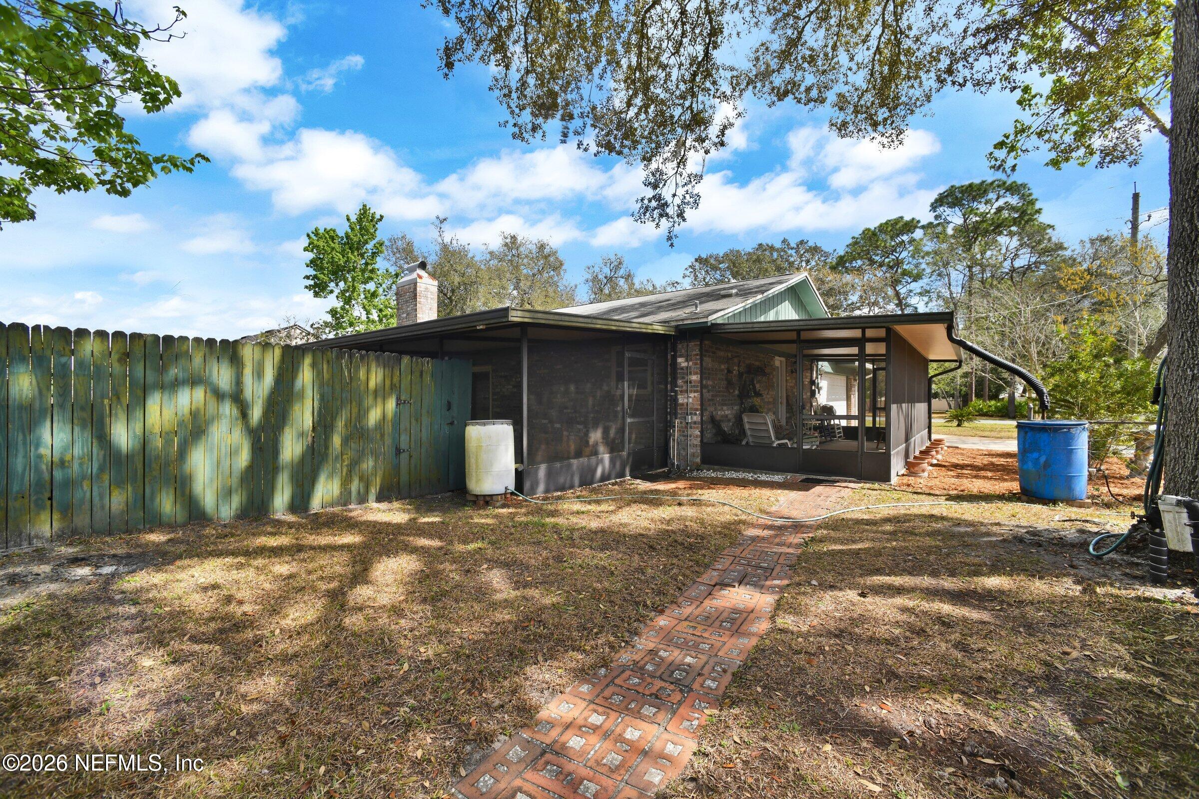 12790 Allport Road Jacksonville, FL 32258 - Photo 9 of 39 a front view of a house with a yard and garage