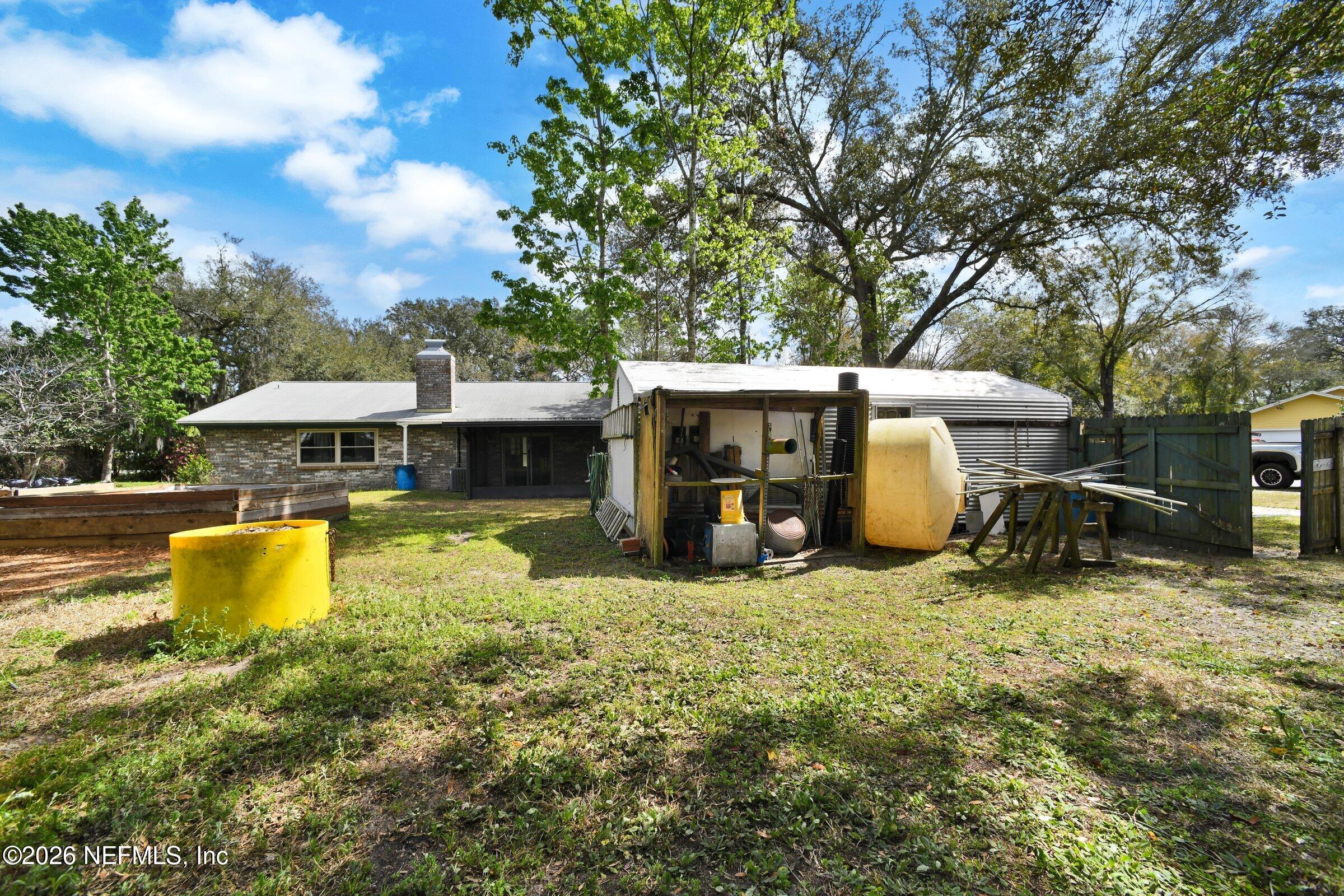 12790 Allport Road Jacksonville, FL 32258 - Photo 10 of 39 a view of a house with swimming pool and sitting area