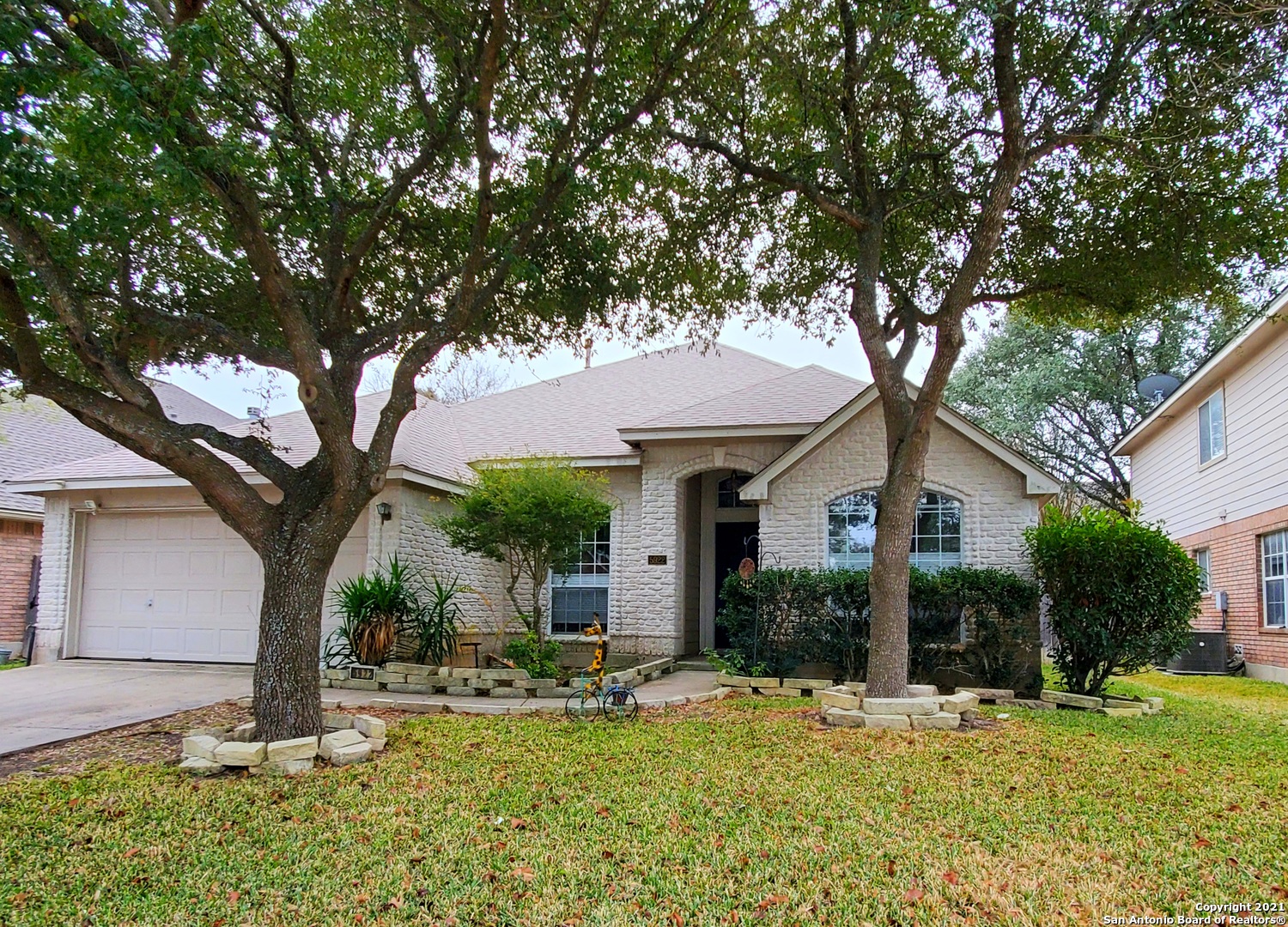 5922 Hart Field San Antonio, TX 78249 - Photo 1 of 21 a front view of a house with a yard