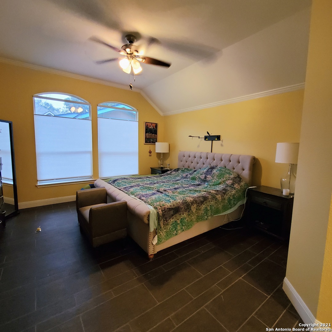 5922 Hart Field San Antonio, TX 78249 - Photo 11 of 21 a bedroom with a bed and window