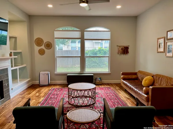 a living room with furniture and a window