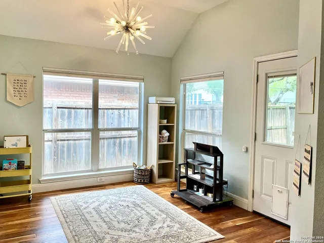 a bedroom with furniture and a window