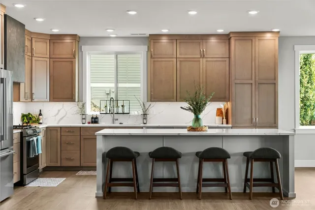 a kitchen with a sink cabinets and window