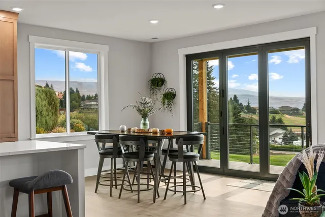 a view of a dining room with furniture window and outside view