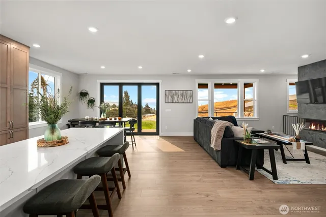 a view of a dining room with furniture window and wooden floor
