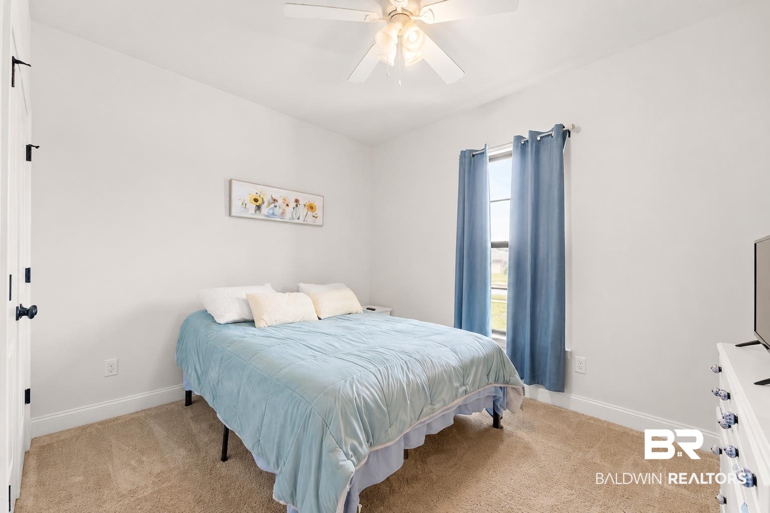 1097 Stella Road Foley, AL 36535 - Photo 11 of 15 Carpeted bedroom featuring a ceiling fan with integrated lighting, a single window with curtain rod, and white baseboards