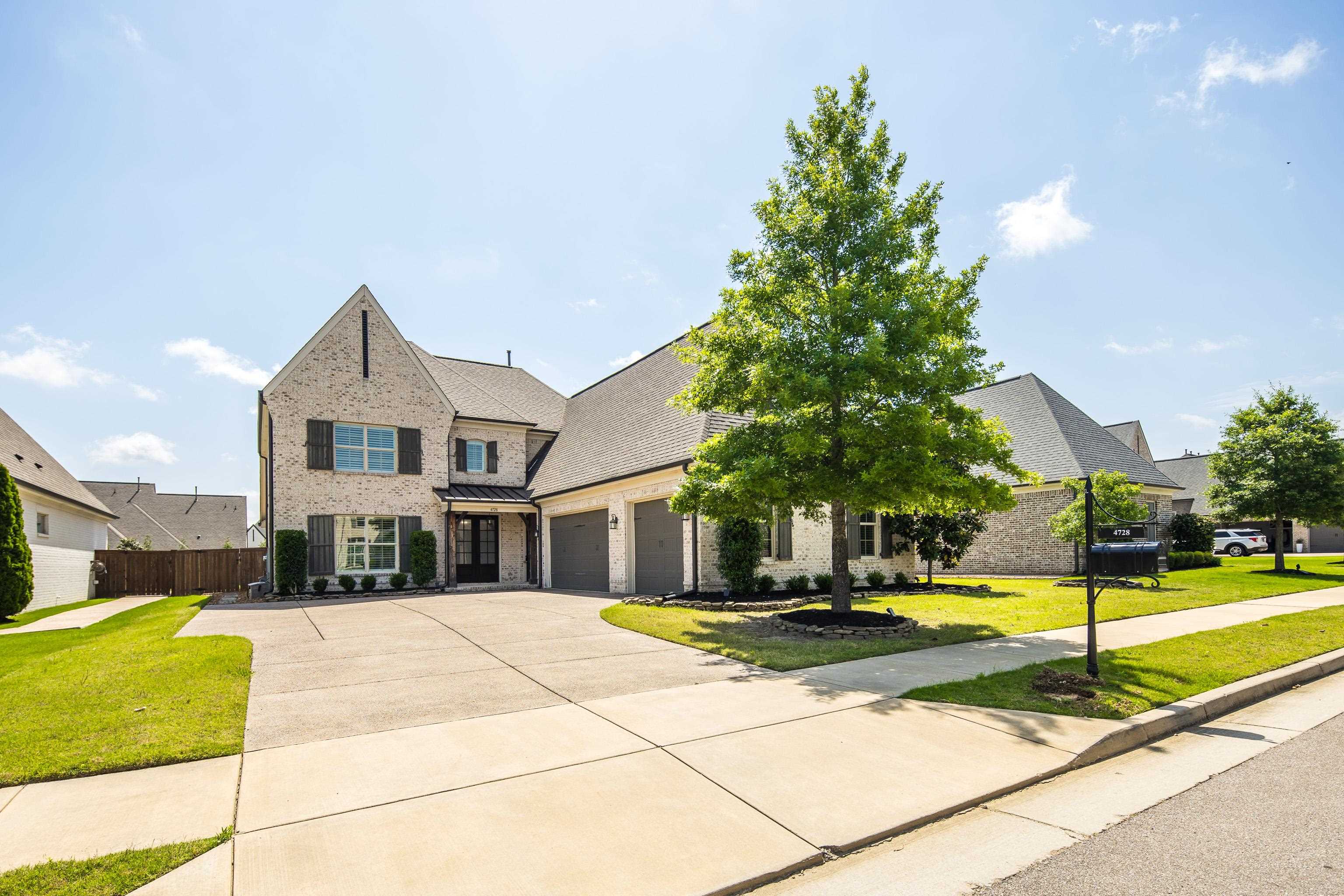 4728 Carousel Lane Collierville, TN 38017 - Photo 1 of 40 View of front facade featuring concrete driveway and an attached garage