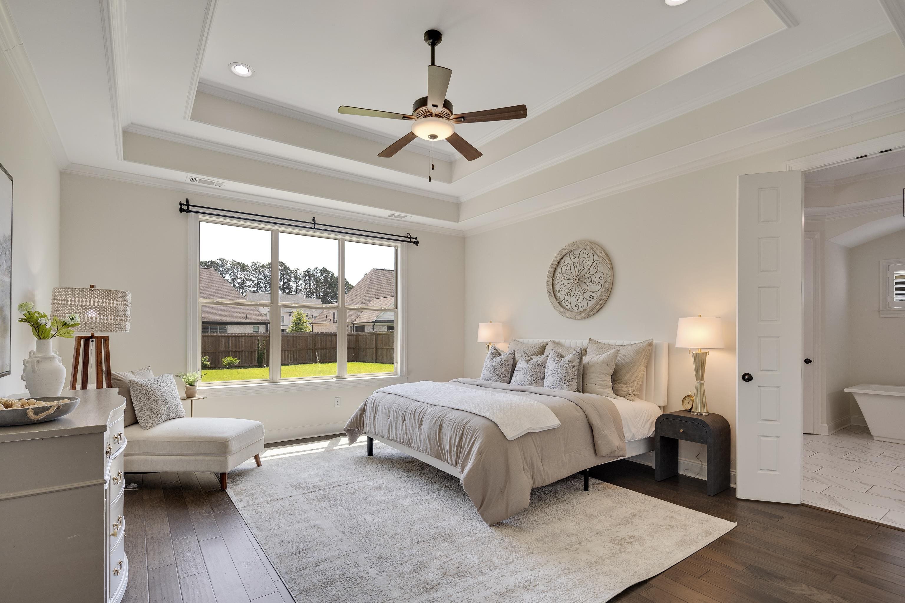 4728 Carousel Lane Collierville, TN 38017 - Photo 16 of 40 Bedroom with a tray ceiling, crown molding, recessed lighting, dark wood-type flooring, and ceiling fan