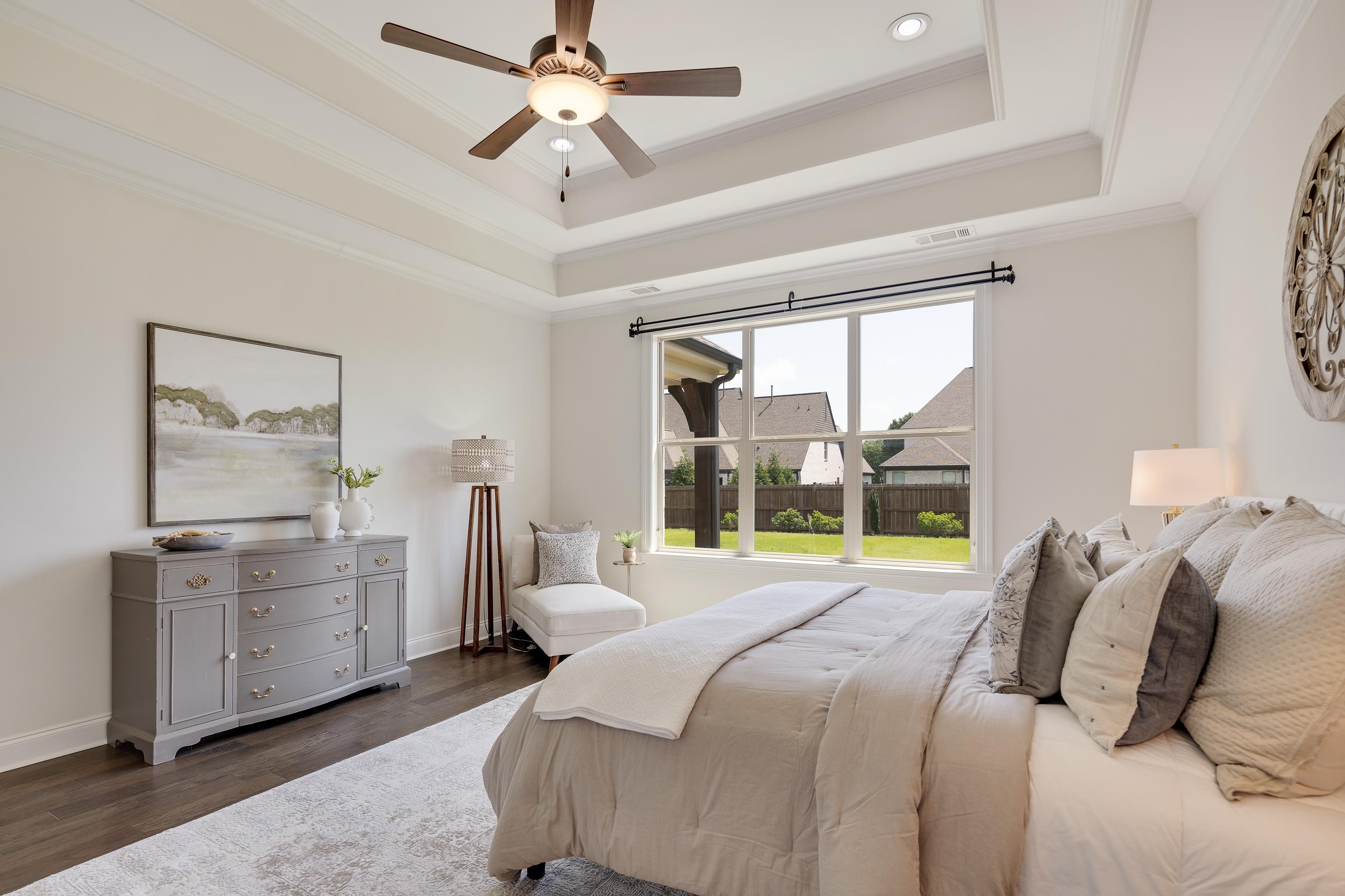 4728 Carousel Lane Collierville, TN 38017 - Photo 17 of 40 Bedroom with a tray ceiling, dark wood-style floors, ornamental molding, baseboards, and recessed lighting