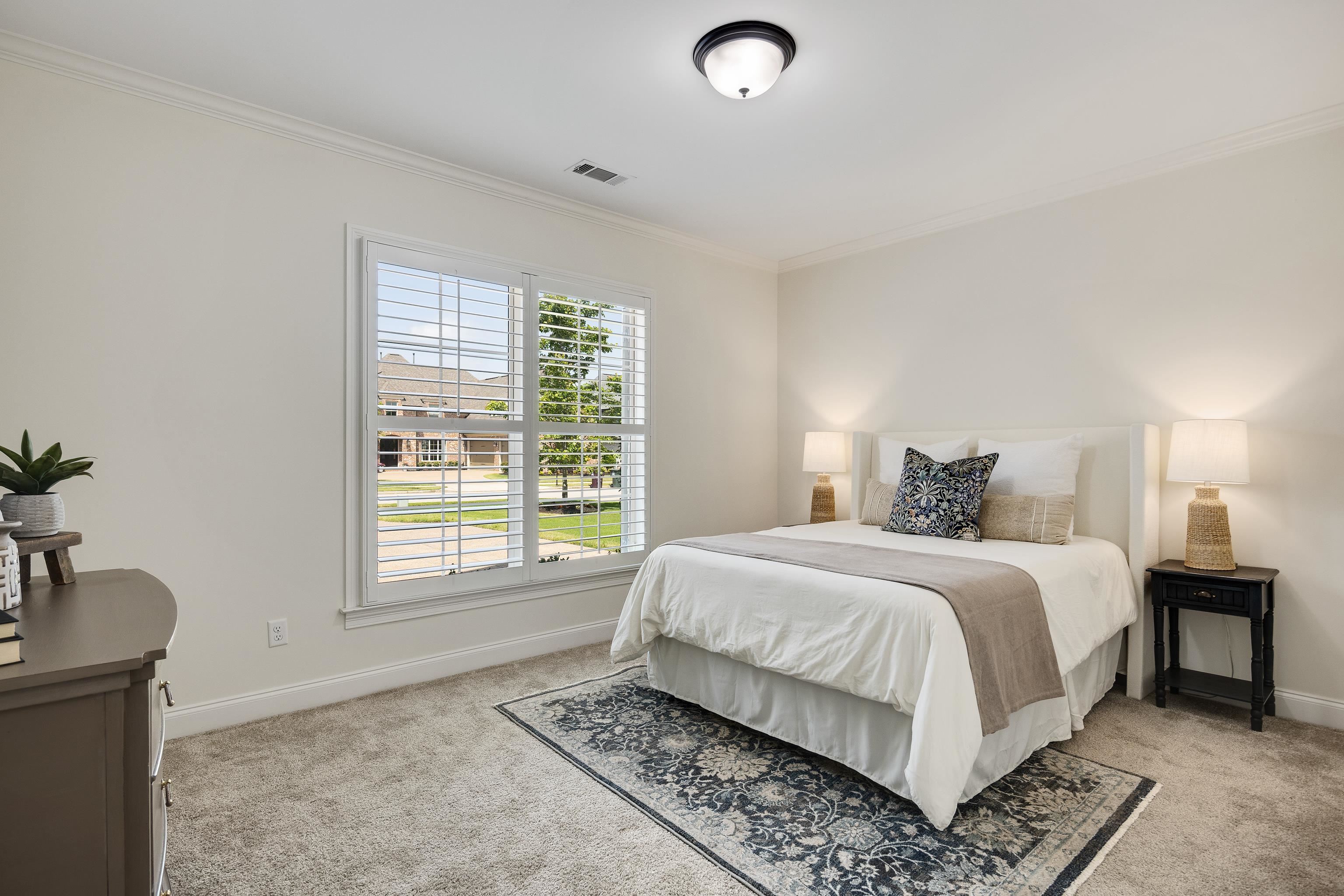 4728 Carousel Lane Collierville, TN 38017 - Photo 21 of 40 Bedroom with light colored carpet, crown molding, and baseboards