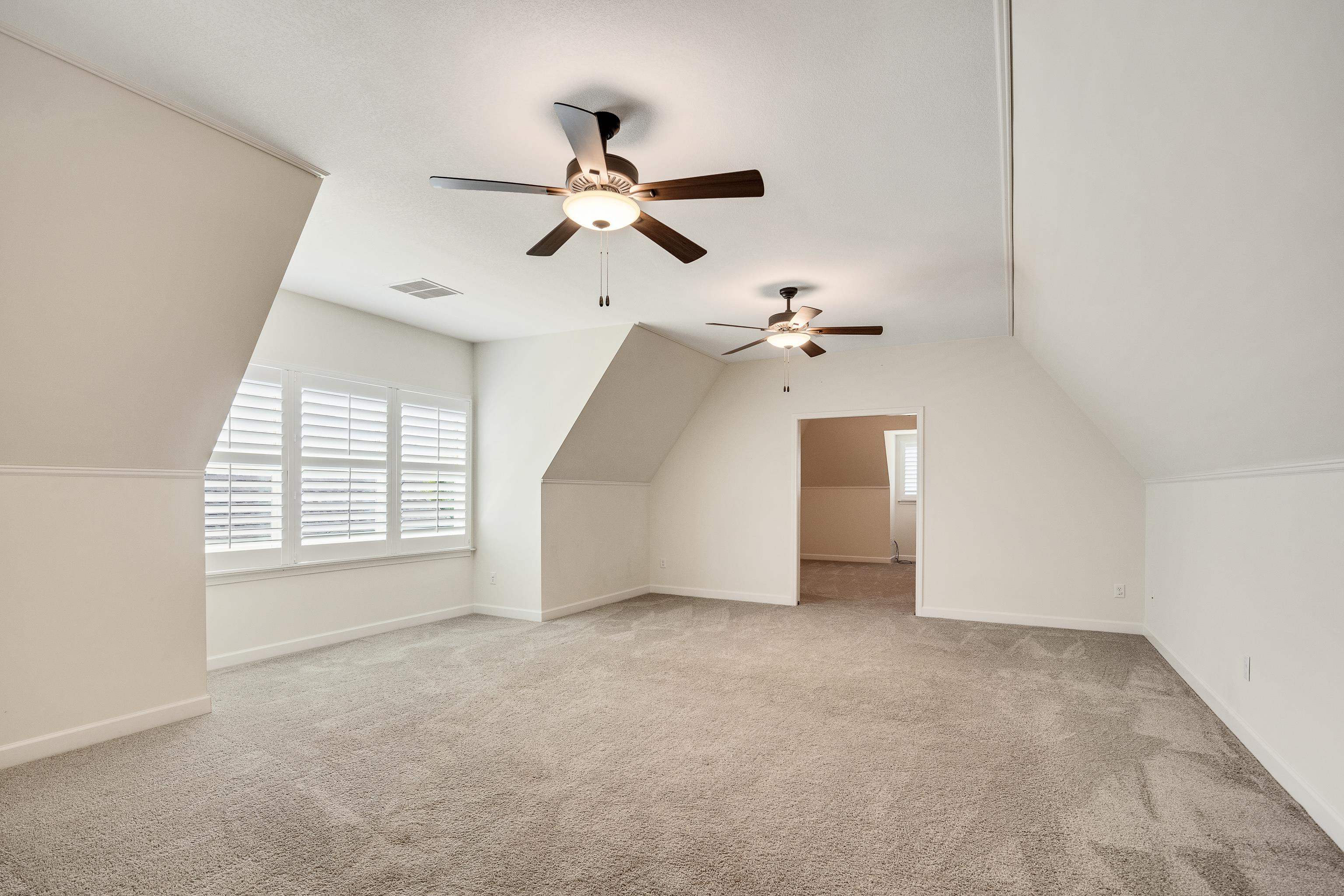 4728 Carousel Lane Collierville, TN 38017 - Photo 31 of 40 Bonus room with ceiling fan, carpet, lofted ceiling, and baseboards