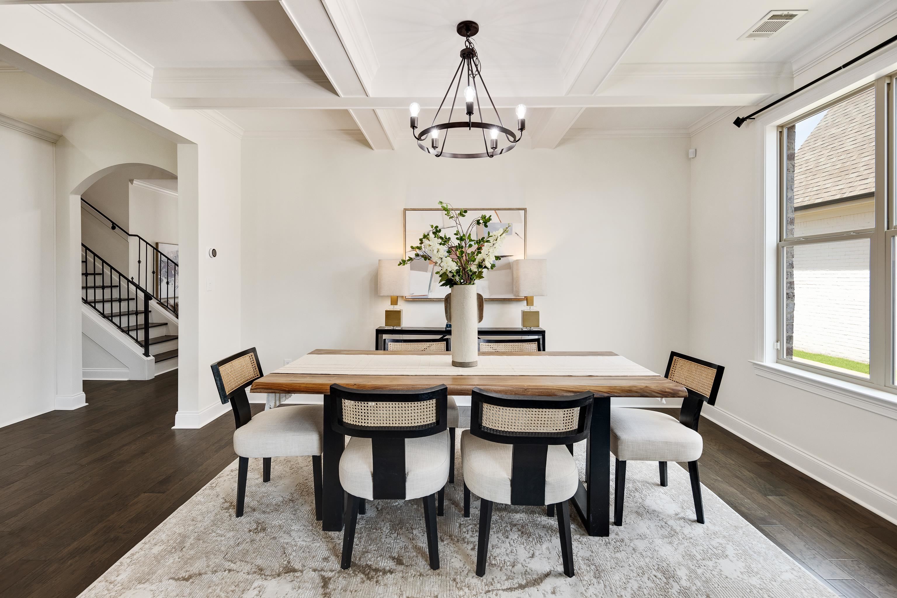 4728 Carousel Lane Collierville, TN 38017 - Photo 10 of 40 Dining area featuring wood finished floors, coffered ceiling, a chandelier, beam ceiling, and baseboards