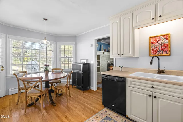 a kitchen that has a cabinets counter space and a table in it