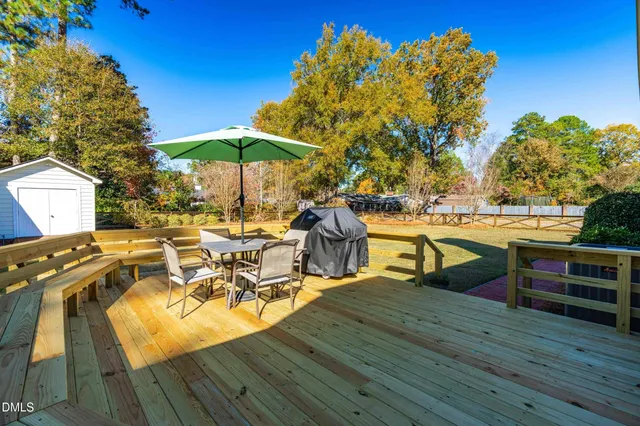 a view of a chairs and table on the wooden floor