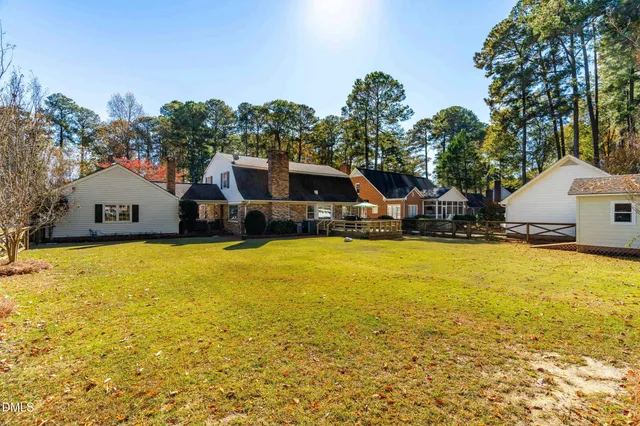 a swimming pool view with a outdoor seating