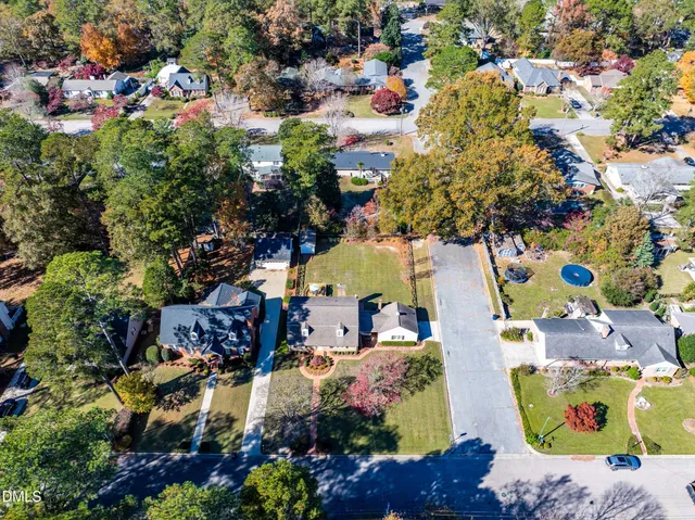 an aerial view of residential house with outdoor space and swimming pool