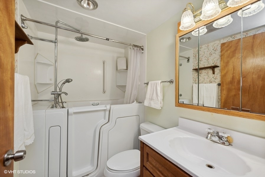 4605 South Ridgeway Road Ringwood, IL 60072 - Photo 14 of 25 a bathroom with a sink toilet and shower